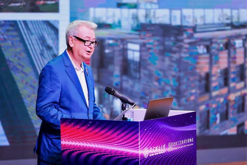 Press image of Stephen Bottomley presenting one of the keynotes