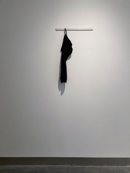 ‘Umbilical (07777688920)’  SMITH/STEWART 2026 (tracksuit bottoms, mobile phone, sound, painted wood, screws)