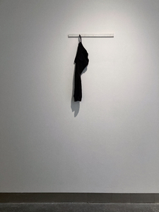 ‘Umbilical (07777688920)’  SMITH/STEWART 2026 (tracksuit bottoms, mobile phone, sound, painted wood, screws)