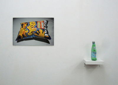 Crisp packet photographed and water bottle sealed at 35,000 feet, cruising altitude