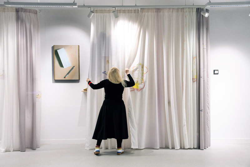 Exquisite Imaginary Cure exhibition view with work by Alex Veness, with (moving) curtain by Zoë Mendelson