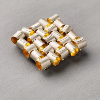 Brooch, kinetic units in silver and gold leaf.  60 x 60 mm