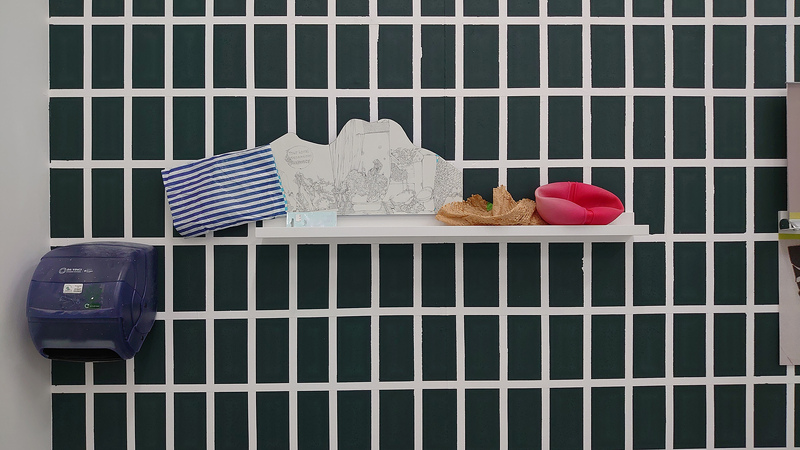 Your Local Dependent Pharmacy (2019) Pencil and acrylic on board, wooden shelf, printed bag, paper, ball, packaging and paper towel dispenser