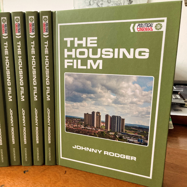 Book cover of The Housing Film, featuring photo of a city skyline